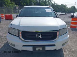 2010 Honda Ridgeline RTL with VIN 5FPYK1F58AB012526, listed as a IAAI auction lot 42421618 with 258,727 mi miles and . Bid and sale history available at DreamBid. Image 12.