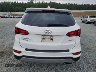 2018 Hyundai Santa Fe 2.4L z VIN 5NMZU3LB6JH104469, wystawiony jako Copart lot #57587495 z przebiegiem 78 267 mil mil oraz Szkoda całkowita • Salvage title. Historia ofert i sprzedaży dostępna na DreamBid. Obrazek 6.