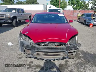 2014 Tesla Model S 60 z VIN 5YJSA1H16EFP42727, wystawiony jako IAAI lot #42544475 z przebiegiem 166 877 mil mil oraz . Historia ofert i sprzedaży dostępna na DreamBid. Obrazek 13.
