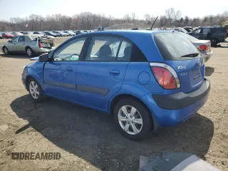 2009 Kia Rio LX with VIN KNADE243296500963, listed as a Copart auction lot 51061595 with 76,596 mi miles and Salvage Title. Bid and sale history available at carsss.com. Image 2.