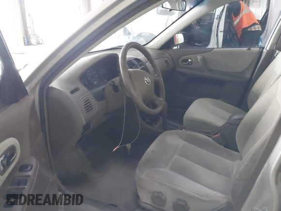 2000 Mazda Protege DX with VIN JM1BJ2221Y0239987, listed as a IAAI auction lot 42092488 with 140,756 mi miles and . Bid and sale history available at DreamBid. Image 5.