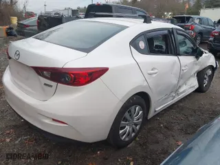 2014 Mazda Mazda3 i Sport with VIN JM1BM1U75E1130979, listed as a IAAI auction lot 41094791 with 100,518 mi miles. Bid and sale history available at carsss.com. Image 4.