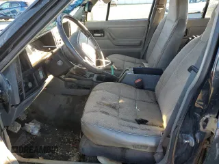 1996 Jeep Cherokee Sport with VIN 1J4FJ68SXTL274898, listed as a Copart auction lot 87676505 with 258,358 mi miles and Salvage Title. Bid and sale history available at carsss.com. Image 7.