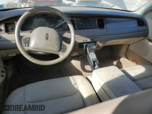 1999 Lincoln Town Car Signature z VIN 1LNHM82W7XY626305, wystawiony jako Copart lot #58009475 z przebiegiem Nie podano mil oraz Szkoda całkowita • Salvage title. Historia ofert i sprzedaży dostępna na DreamBid. Obrazek 8.