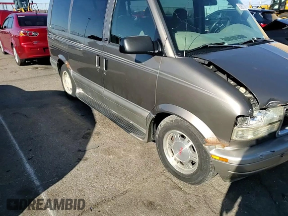 2003 GMC Safari z VIN 1GKDM19X13B516327, wystawiony jako Copart lot #83827794 z przebiegiem 200 280 mil mil oraz Szkoda całkowita • Salvage title. Historia ofert i sprzedaży dostępna na DreamBid. Obrazek 11.