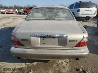 1999 Jaguar XJ with VIN SAJKX6040XC857312, listed as a Copart auction lot 84918704 with 75,425 mi miles and Clean Title. Bid and sale history available at carsss.com. Image 6.