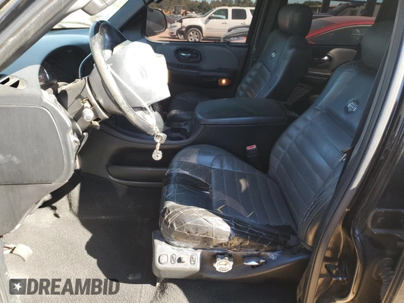 2002 Ford F-150 Harley Davidson with VIN 1FTRW07332KD46296, listed as a Copart auction lot 76333404 with 160,616 mi miles and Salvage Title. Bid and sale history available at carsss.com. Image 7.