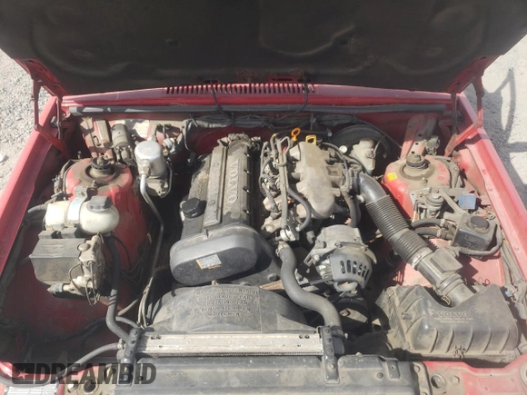 1991 Volvo 900 z VIN YV1JA8943MA045997, wystawiony jako Copart lot #74633174 z przebiegiem 296 013 mil mil oraz Szkody całkowita. Historia ofert i sprzedaży dostępna na DreamBid. Obrazek 13.