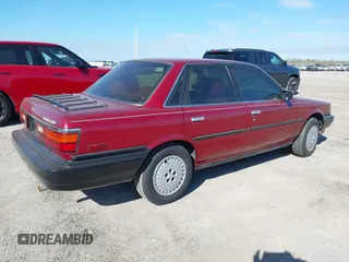 1989 Toyota Camry DLX с VIN 4T1SV21E9KU059104, выставлен на аукционе IAAI как лот 41014925 с пробегом 312 844 миль миль и . История ставок и продаж доступна на DreamBid. Изображение 4.