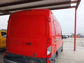 2016 Ford Transit Cargo with VIN 1FTYR2CMXGKA52348, listed as a IAAI auction lot 42048277 with 215,295 mi miles and . Bid and sale history available at DreamBid. Image 4.
