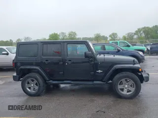 2013 Jeep Wrangler Unlimited Sport z VIN 1C4BJWDGXDL596450, wystawiony jako IAAI lot #42323862 z przebiegiem 114 105 mil mil oraz . Historia ofert i sprzedaży dostępna na DreamBid. Obrazek 14.
