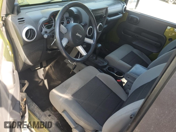 2010 Jeep Wrangler Sahara with VIN 1J4AA5D16AL203910, listed as a Copart auction lot 62891315 with 124,337 mi miles and Salvage title. Bid and sale history available at DreamBid. Image 8.