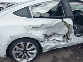 2018 Tesla Model 3 Long Range Battery with VIN 5YJ3E1EB2JF089006, listed as a IAAI auction lot 41186372 with Not Provided miles and . Bid and sale history available at DreamBid. Image 6.