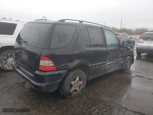2001 Mercedes-Benz M-Class with VIN 4JGAB54E51A273024, listed as a Copart auction lot 80327264 with 211,120 mi miles and Salvage Title. Bid and sale history available at carsss.com. Image 3.
