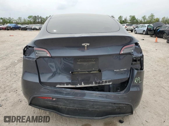 2022 Tesla Model Y Long Range with VIN 7SAYGDEE1NF315198, listed as a Copart auction lot 50399005 with 33,357 mi miles and Salvage Title. Bid and sale history available at DreamBid. Image 6.