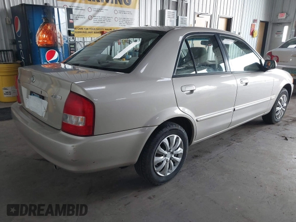 2000 Mazda Protege DX with VIN JM1BJ2221Y0239987, listed as a IAAI auction lot 42092488 with 140,756 mi miles and . Bid and sale history available at DreamBid. Image 4.