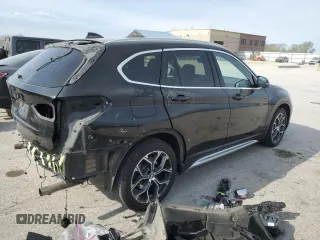 2020 BMW X1 xDrive28i with VIN WBXJG9C06L5P89796, listed as a Copart auction lot 52817235 with 95,665 mi miles and Salvage title. Bid and sale history available at DreamBid. Image 3.
