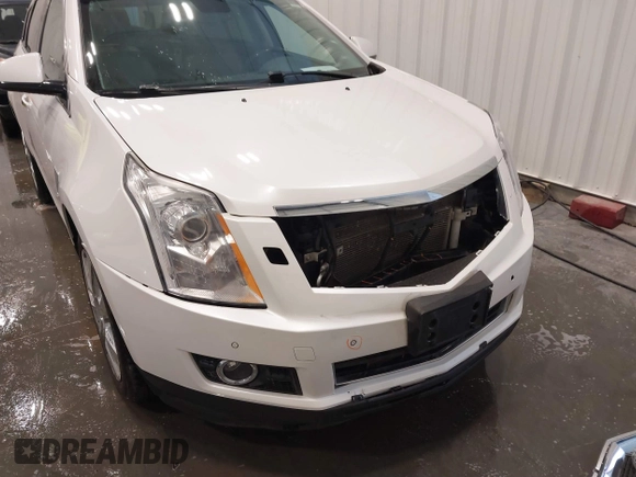 2012 Cadillac SRX Premium Collection z VIN 3GYFNFE38CS591123, wystawiony jako IAAI lot #41827636 z przebiegiem 143 867 mil mil oraz . Historia ofert i sprzedaży dostępna na DreamBid. Obrazek 6.