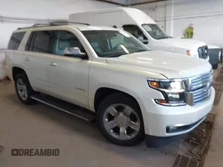 2015 Chevrolet Tahoe LTZ z VIN 1GNSKCKC9FR123996, wystawiony jako IAAI lot #42113435 z przebiegiem 149 825 mil mil oraz . Historia ofert i sprzedaży dostępna na DreamBid. Obrazek 1.