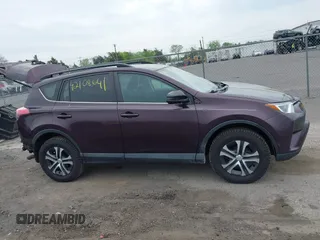 2018 Toyota RAV4 LE with VIN 2T3BFREV9JW771845, listed as a IAAI auction lot 42108641 with 127,394 mi miles. Bid and sale history available at carsss.com. Image 14.
