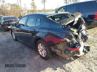 2025 Toyota Camry LE with VIN 4T1DAACK6SU013957, listed as a IAAI auction lot 41500800 with 31,414 mi miles and . Bid and sale history available at DreamBid. Image 3.