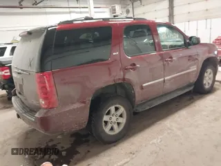 2011 GMC Yukon SLT with VIN 1GKS2CE08BR308792, listed as a IAAI auction lot 41633427 with 216,483 mi miles. Bid and sale history available at carsss.com. Image 4.