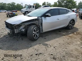 2016 Nissan Maxima Platinum with VIN 1N4AA6AP5GC404491, listed as a Copart auction lot 60452875 with 164,496 mi miles and Salvage title. Bid and sale history available at DreamBid. Image 1.