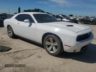 2016 Dodge Challenger SXT with VIN 2C3CDZAG2GH100869, listed as a Copart auction lot 56242785 with 136,163 mi miles and Salvage title. Bid and sale history available at DreamBid. Image 4.