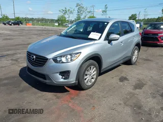 2016 Mazda CX-5 Touring z VIN JM3KE4CY4G0646114, wystawiony jako IAAI lot #42269181 z przebiegiem 58 252 mil mil oraz . Historia ofert i sprzedaży dostępna na DreamBid. Obrazek 2.