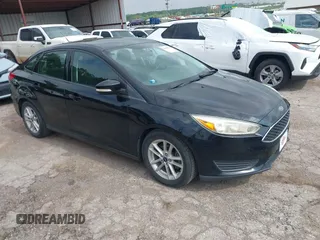 2016 Ford Focus SE z VIN 1FADP3F2XGL312445, wystawiony jako IAAI lot #42288210 z przebiegiem 64 115 mil mil oraz . Historia ofert i sprzedaży dostępna na DreamBid. Obrazek 1.