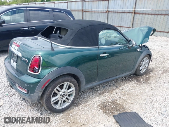 2013 MINI Roadster S z VIN WMWSY3C55DT566134, wystawiony jako IAAI lot #42265800 z przebiegiem 170 001 mil mil oraz . Historia ofert i sprzedaży dostępna na DreamBid. Obrazek 4.