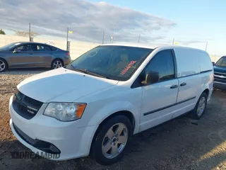 2014 Ram Cargo Van Tradesman with VIN 2C4JRGAGXER230933, listed as a IAAI auction lot 41166912 with 249,840 mi miles. Bid and sale history available at carsss.com. Image 2.
