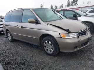 2004 Honda Odyssey EX-L z VIN 5FNRL18914B036407, wystawiony jako IAAI lot #41939932 z przebiegiem 243 790 mil mil oraz . Historia ofert i sprzedaży dostępna na DreamBid. Obrazek 1.