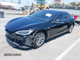 2017 Tesla Model S 60 with VIN 5YJSA1E17HF232699, listed as a IAAI auction lot 42327539 with 113,923 mi miles and . Bid and sale history available at DreamBid. Image 2.