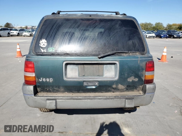 1995 Jeep Grand Cherokee Laredo with VIN 1J4FX58S5SC741328, listed as a Copart auction lot 82034594 with 260,398 mi miles and Clean Title. Bid and sale history available at carsss.com. Image 6.
