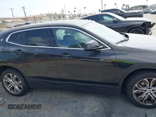 2019 BMW X2 sDrive28i with VIN WBXYJ3C58KEP77334, listed as a IAAI auction lot 42575165 with 98,910 mi miles and . Bid and sale history available at DreamBid. Image 13.