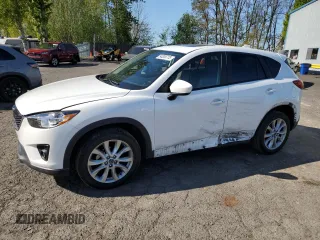 2014 Mazda CX-5 Grand Touring with VIN JM3KE4DY2E0354795, listed as a Copart auction lot 54205775 with 62,939 mi miles and Salvage Title. Bid and sale history available at DreamBid. Image 1.