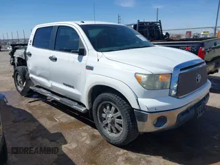 2012 Toyota Tundra with VIN 5TFEY5F12CX129901, listed as a IAAI auction lot 41813961 with 95,749 mi miles and . Bid and sale history available at DreamBid. Image 1.