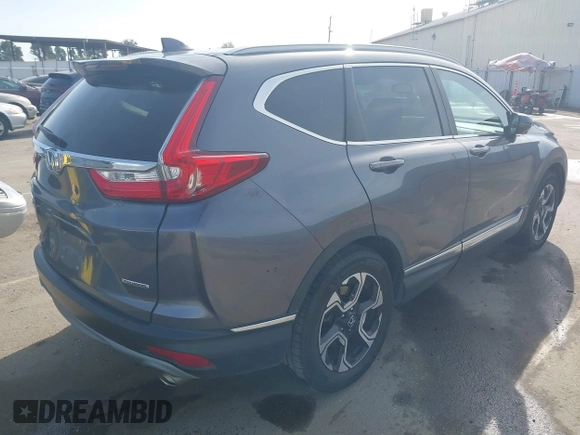 2018 Honda CR-V Touring with VIN 7FARW1H93JE027294, listed as a IAAI auction lot 41903484 with 80,999 mi miles and . Bid and sale history available at DreamBid. Image 4.