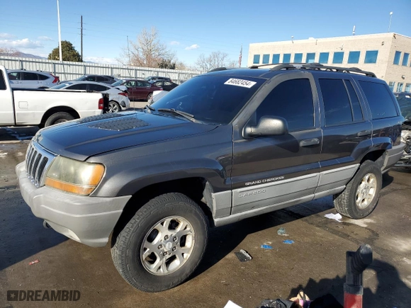 1999 Jeep Grand Cherokee Laredo with VIN 1J4GW58N9XC633464, listed as a Copart auction lot 84682454 with 212,738 mi miles and Salvage Title. Bid and sale history available at carsss.com. Image 1.
