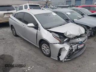 2020 Toyota Prius L Eco z VIN JTDKARFU4L3115594, wystawiony jako IAAI lot #42042342 z przebiegiem 54 720 mil mil oraz . Historia ofert i sprzedaży dostępna na DreamBid. Obrazek 1.