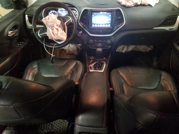 2014 Jeep Cherokee Trailhawk with VIN 1C4PJMBS0EW308775, listed as a Copart auction lot 60465125 with 117,326 mi miles and Salvage title. Bid and sale history available at DreamBid. Image 8.