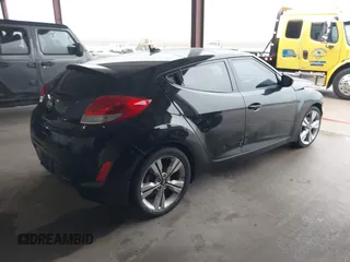 2017 Hyundai Veloster Value Edition with VIN KMHTC6AD6HU321999, listed as a IAAI auction lot 41611017 with 99,382 mi miles. Bid and sale history available at carsss.com. Image 4.