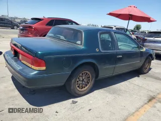 1995 Mercury Cougar z VIN 1MELM62W5SH627799, wystawiony jako Copart lot #61115064 z przebiegiem 31 957 mil mil oraz Szkody całkowita. Historia ofert i sprzedaży dostępna na DreamBid. Obrazek 3.