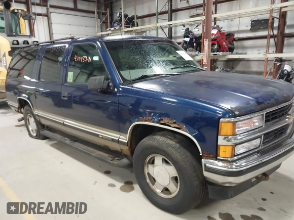 1999 Chevrolet Suburban z VIN 1GNFK16R1XJ409829, wystawiony jako IAAI lot #42045240 z przebiegiem 337 554 mil mil oraz . Historia ofert i sprzedaży dostępna na DreamBid. Obrazek 1.