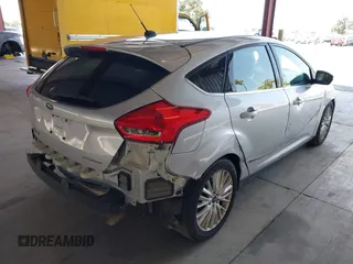 2017 Ford Focus Titanium z VIN 1FADP3N2XHL288103, wystawiony jako IAAI lot #42573844 z przebiegiem 128 952 mil mil oraz . Historia ofert i sprzedaży dostępna na DreamBid. Obrazek 4.