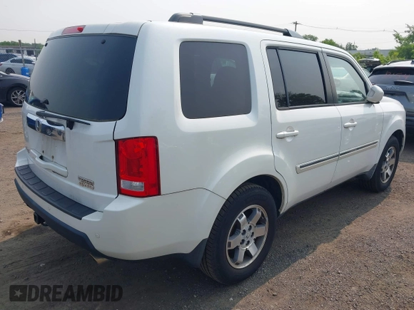2011 Honda Pilot Touring z VIN 5FNYF4H9XBB003469, wystawiony jako IAAI lot #42369323 z przebiegiem 201 958 mil mil oraz . Historia ofert i sprzedaży dostępna na DreamBid. Obrazek 4.