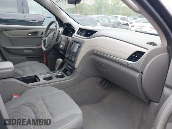 2015 Chevrolet Traverse LS z VIN 1GNKRFKDXFJ107942, wystawiony jako IAAI lot #42111246 z przebiegiem 128 036 mil mil oraz . Historia ofert i sprzedaży dostępna na DreamBid. Obrazek 5.
