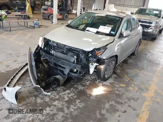2022 Kia Rio S with VIN 3KPA24AD2NE473517, listed as a IAAI auction lot 41704769 with 52,810 mi miles. Bid and sale history available at carsss.com. Image 2.
