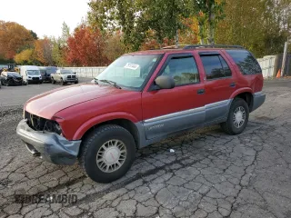 1999 GMC Jimmy SLE with VIN 1GKDT13W6X2508118, listed as a Copart auction lot 79761444 with 195,738 mi miles and Salvage Title. Bid and sale history available at carsss.com. Image 1.
